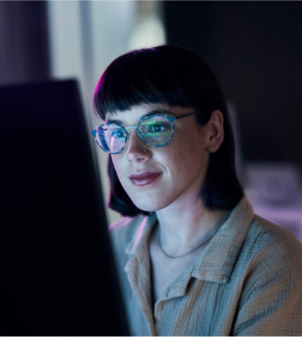 image of woman reading from a computer screen